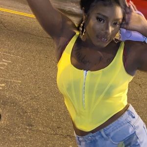 Neon green corset top with built in support fits like a glove